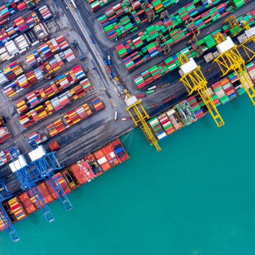 Aerial top view container ship at terminal seaport, Global business cargo freight ship import export logistic and transportation by container vessel ship company worldwide.